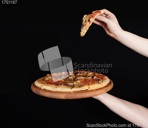 Image of Tasty pizza and hand