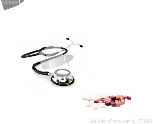 Image of doctors stethoscope with pills
