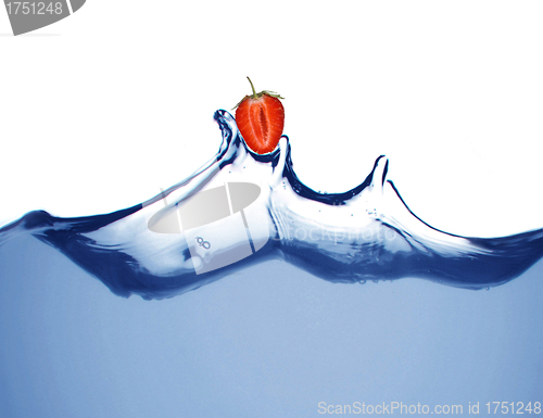 Image of fresh strawberries in a spray of water