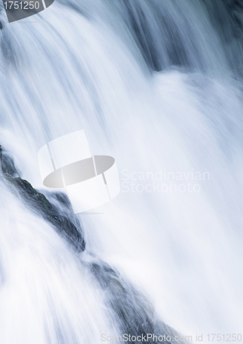 Image of water cascade streaming down a lasher