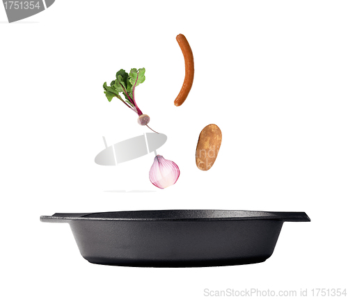 Image of Flipping veggies with pan studio isolated
