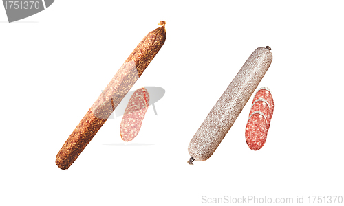 Image of Two salami sticks with slices isolated on white