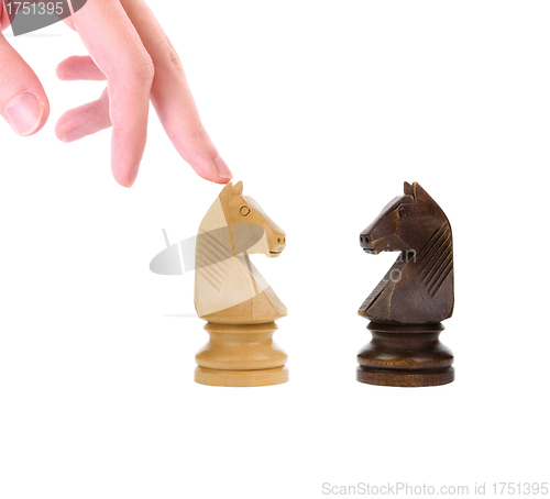 Image of White and black knights on chess board