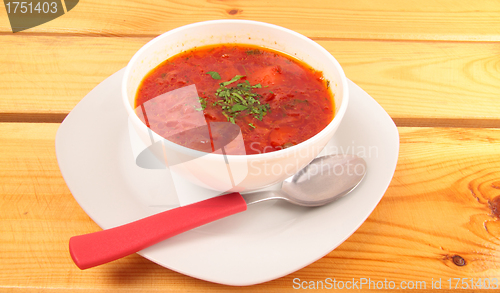 Image of soup in ceramic bowl on white