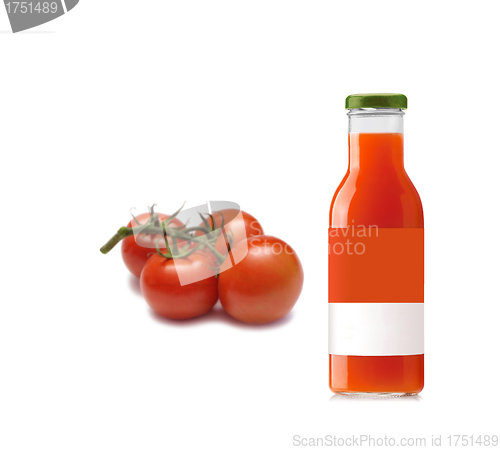 Image of Full glass of fresh tomato juice and tomatoes