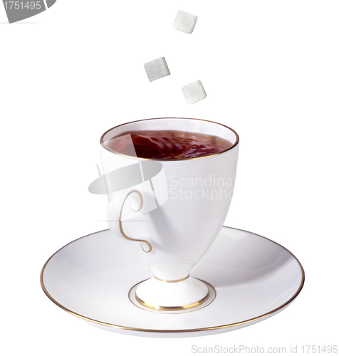 Image of Cup of tea and falling sugar cubes