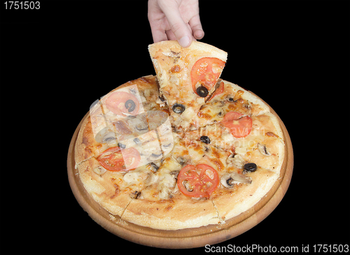 Image of Tasty pizza and hand on black background
