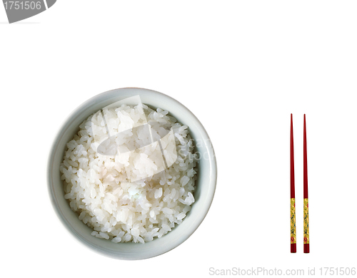 Image of Chopsticks on a white bowl against a white tablecloth