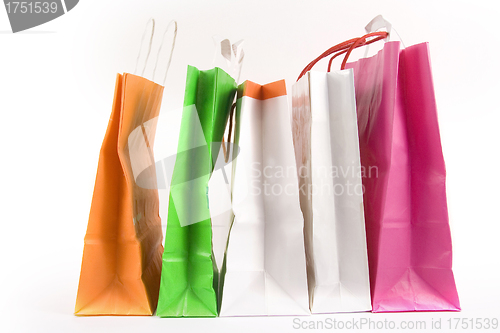 Image of Assorted colored shopping bags on a white background