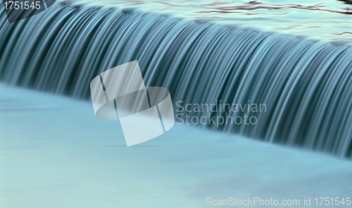 Image of water cascade streaming down a lasher