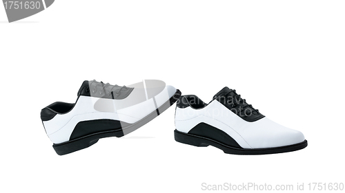 Image of A pair of white golf shoes