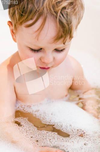 Image of The little boy bathes in bathing with foam