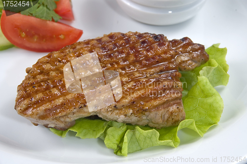 Image of Piece of fried meat with vegetables.