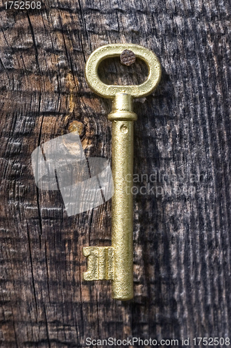 Image of Old key of gold colour.