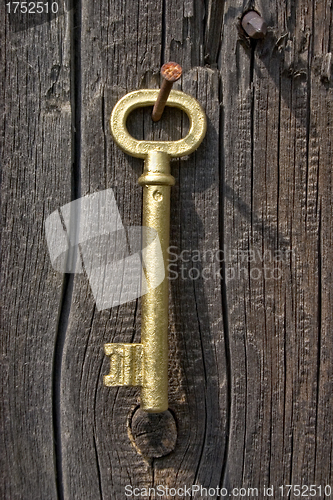 Image of Old key of gold colour.