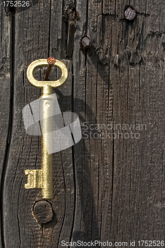 Image of Old key of gold colour.