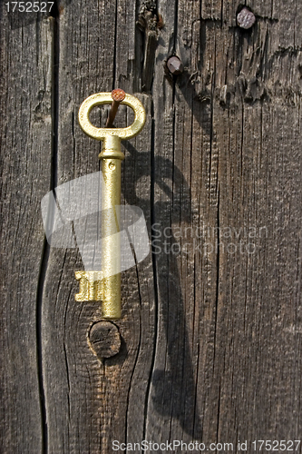 Image of Old key of gold colour.