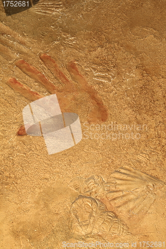 Image of Red hand print on stone