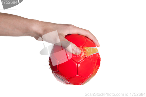 Image of A hand hold a red ball.