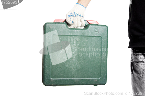 Image of Green tool box in workers hand