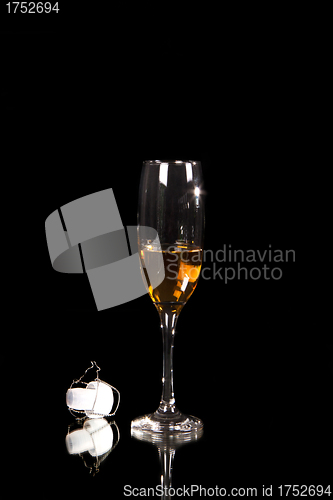 Image of champagne glass with plastic corn