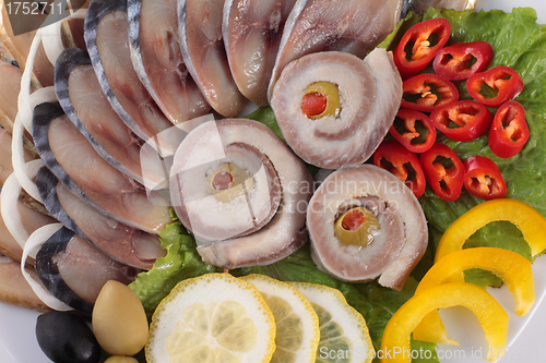 Image of fish with vegetables,anion red pepper