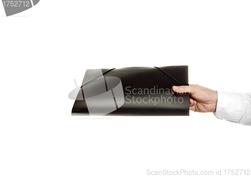 Image of hand holding a folder