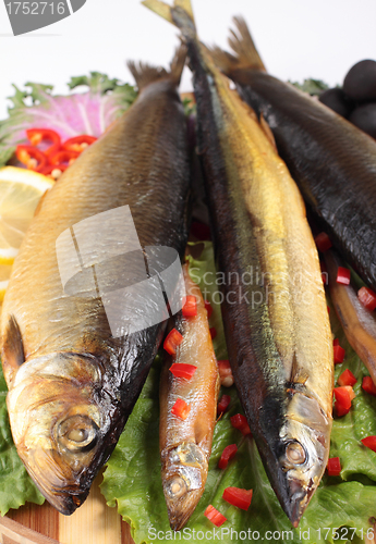 Image of fish on plate with red pepper