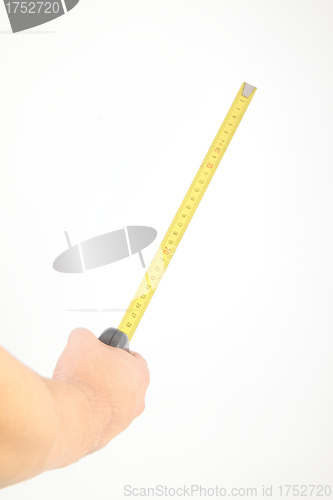 Image of hand measuring by tape measure