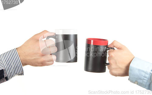 Image of Businessman hand holding a cup of tea