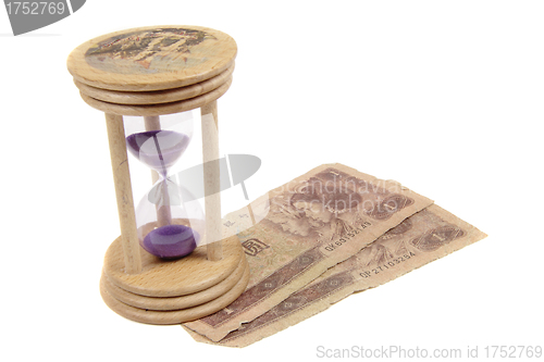 Image of Hour Glass wiyh money isolated