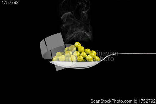 Image of fresh frozen peas on spoon