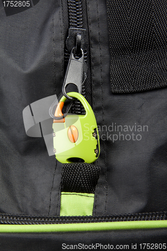 Image of Green lock on a bag's zipper