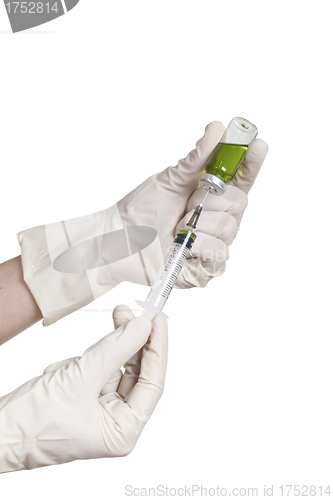 Image of Hand holding syringe isolated on white