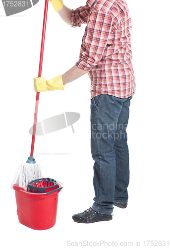 Image of man puts the mop in a bucket