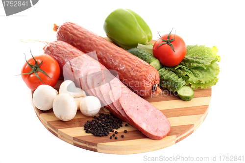 Image of sausage on plate with vegetables