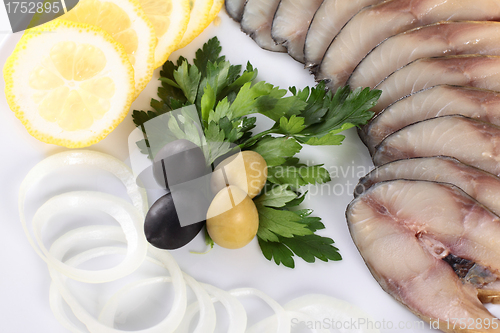 Image of fish with vegetables,anion olives