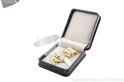 Image of golden clip in box isolated