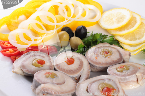 Image of fish with vegetables and olives