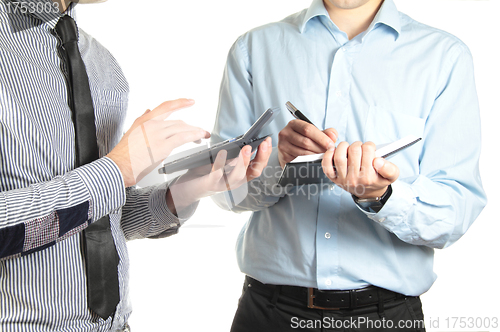 Image of Two businessmen making calculations