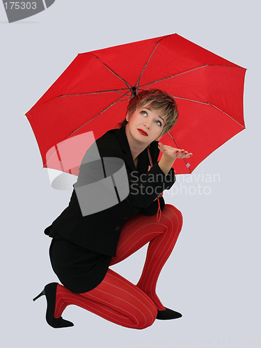 Image of Businesswoman with a red umbrella