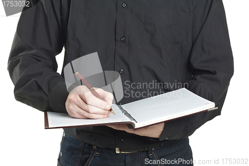 Image of businessman taking note in a notepad