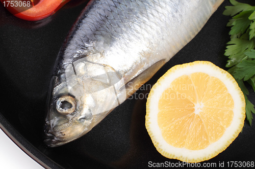 Image of fish on pan with lemon