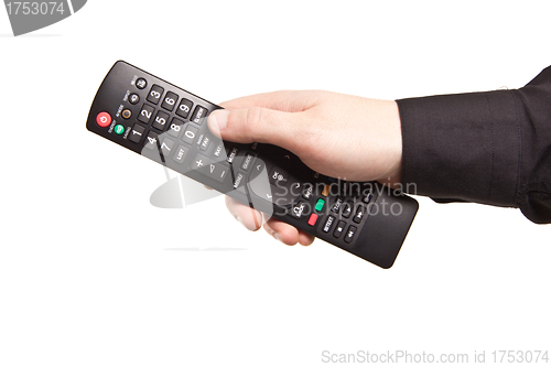 Image of Hand with TV remote control isolated