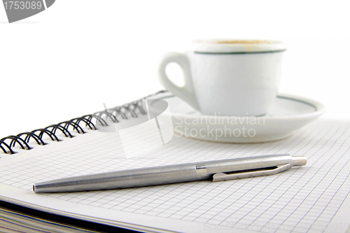 Image of blank page, empty cup of coffe, pen