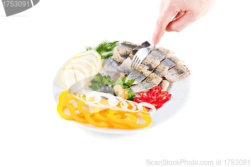 Image of fish on plate with vegetables