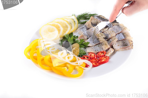 Image of fish on plate with vegetables