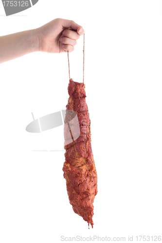 Image of hand holding meat