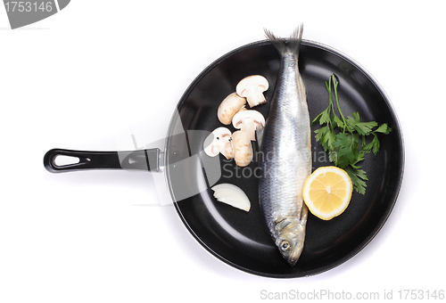 Image of fish in pan with vegetables