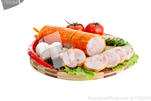 Image of sausages in coposition with vegetables